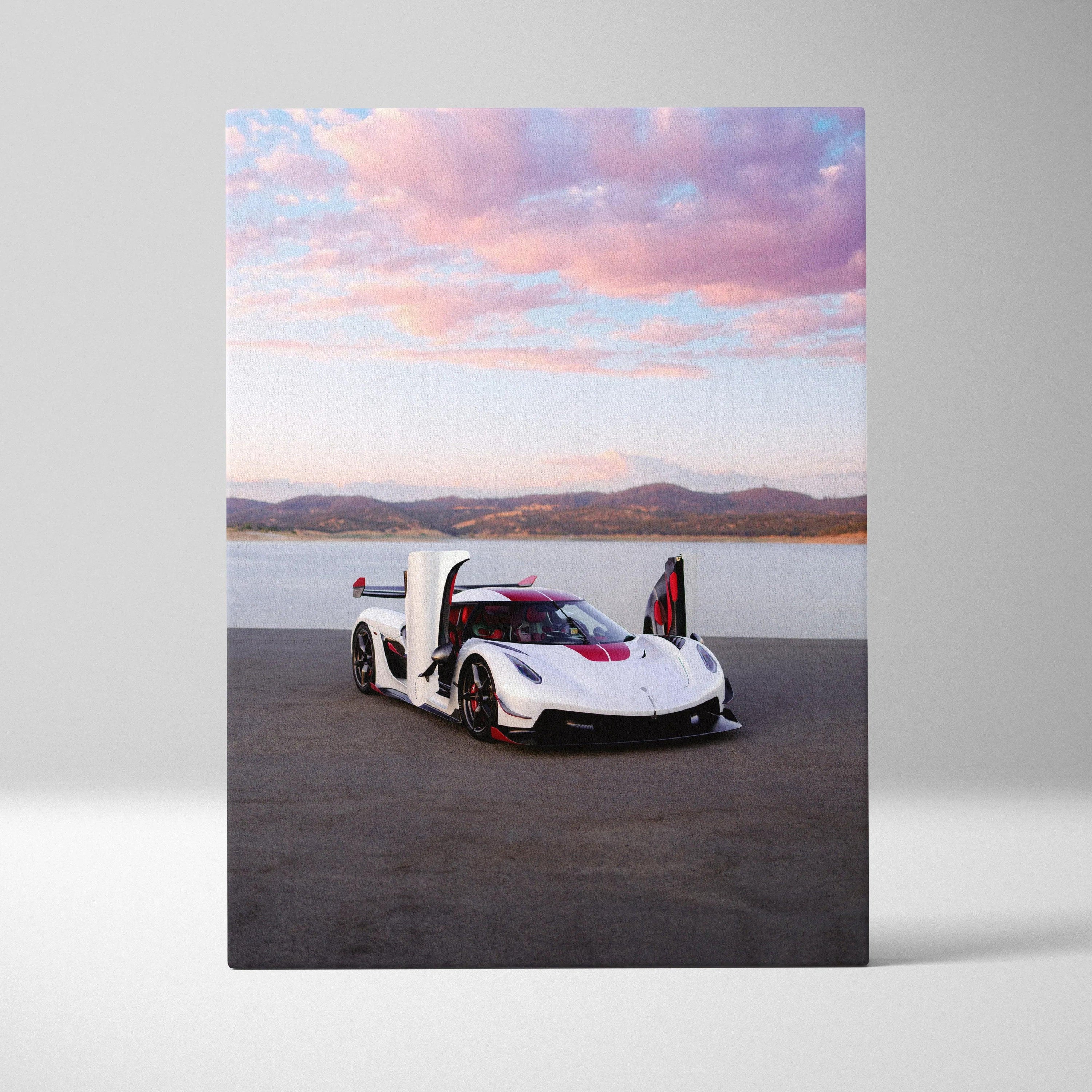 White Koenigsegg Jesko sports car with open vertical doors on canvas wall art with sunset sky background.