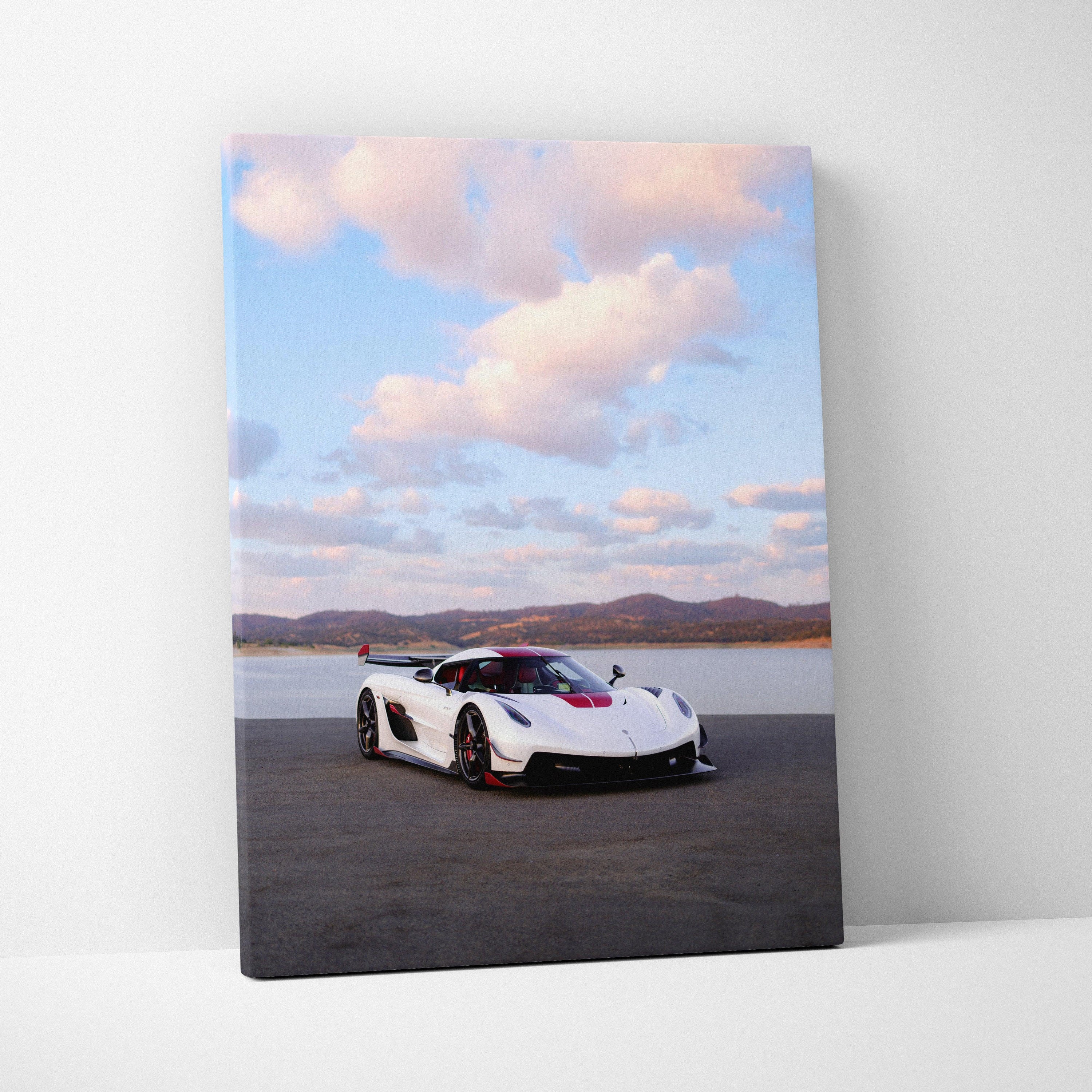 Vertical canvas art of white Koenigsegg Jesko sports car on asphalt with cloudy sky background.