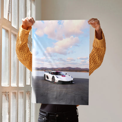 Koenigsegg Jesko car on racetrack poster wall art with blue sky and clouds.