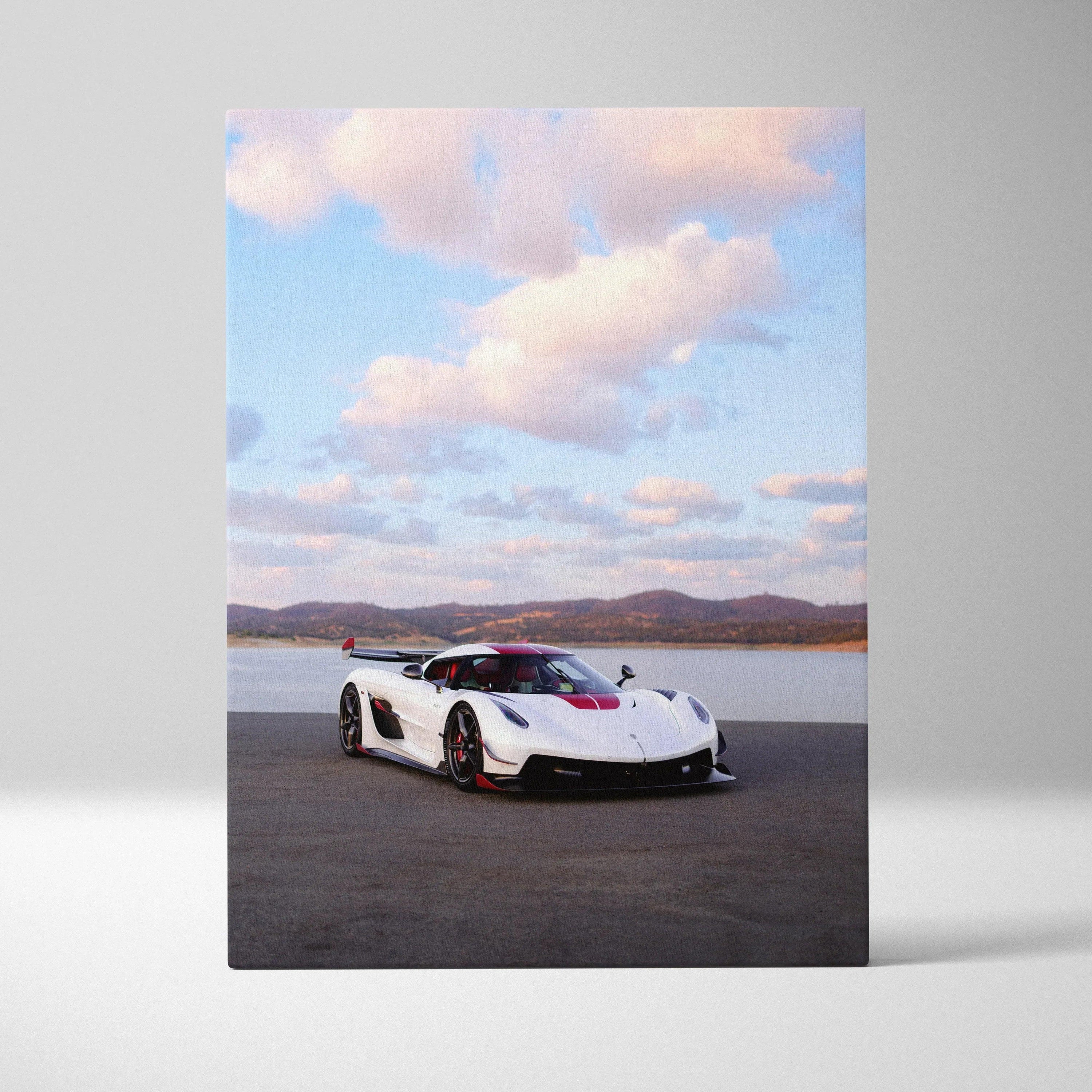 Vertical canvas art featuring a white Koenigsegg Jesko sports car under a cloudy sky, wall art with automotive theme.