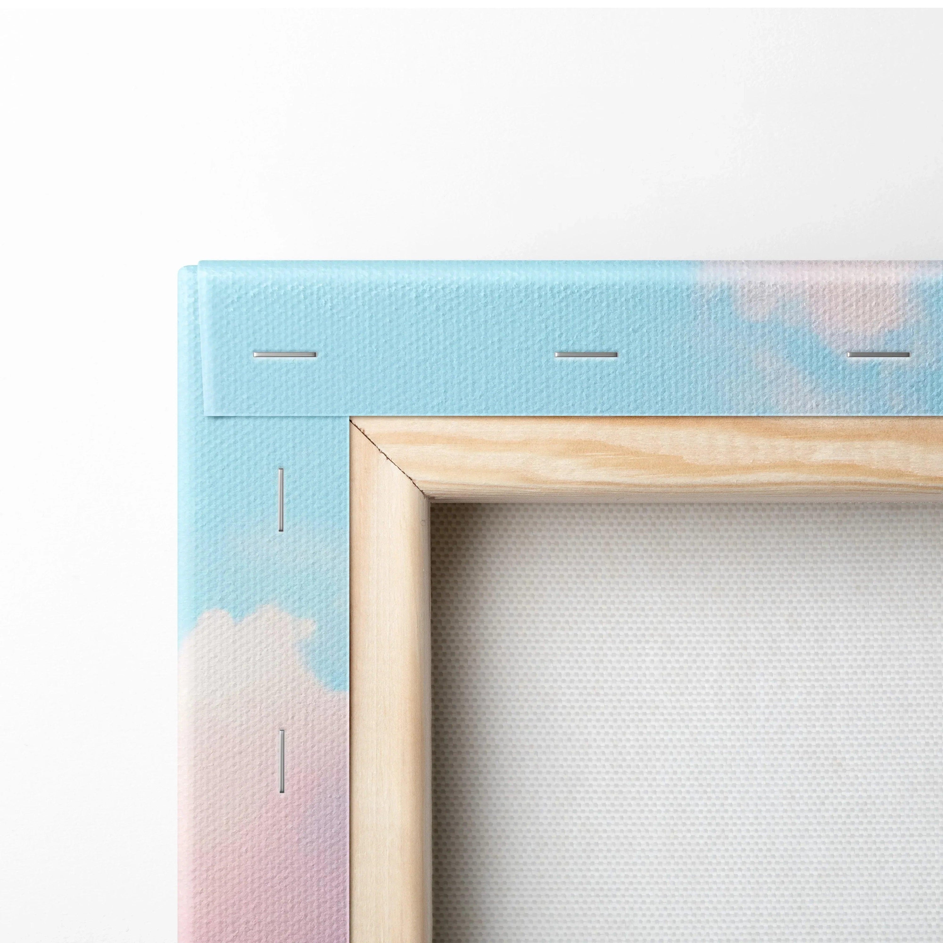 Close-up of wooden frame corner on blue and pink gradient canvas wall art with visible staples.