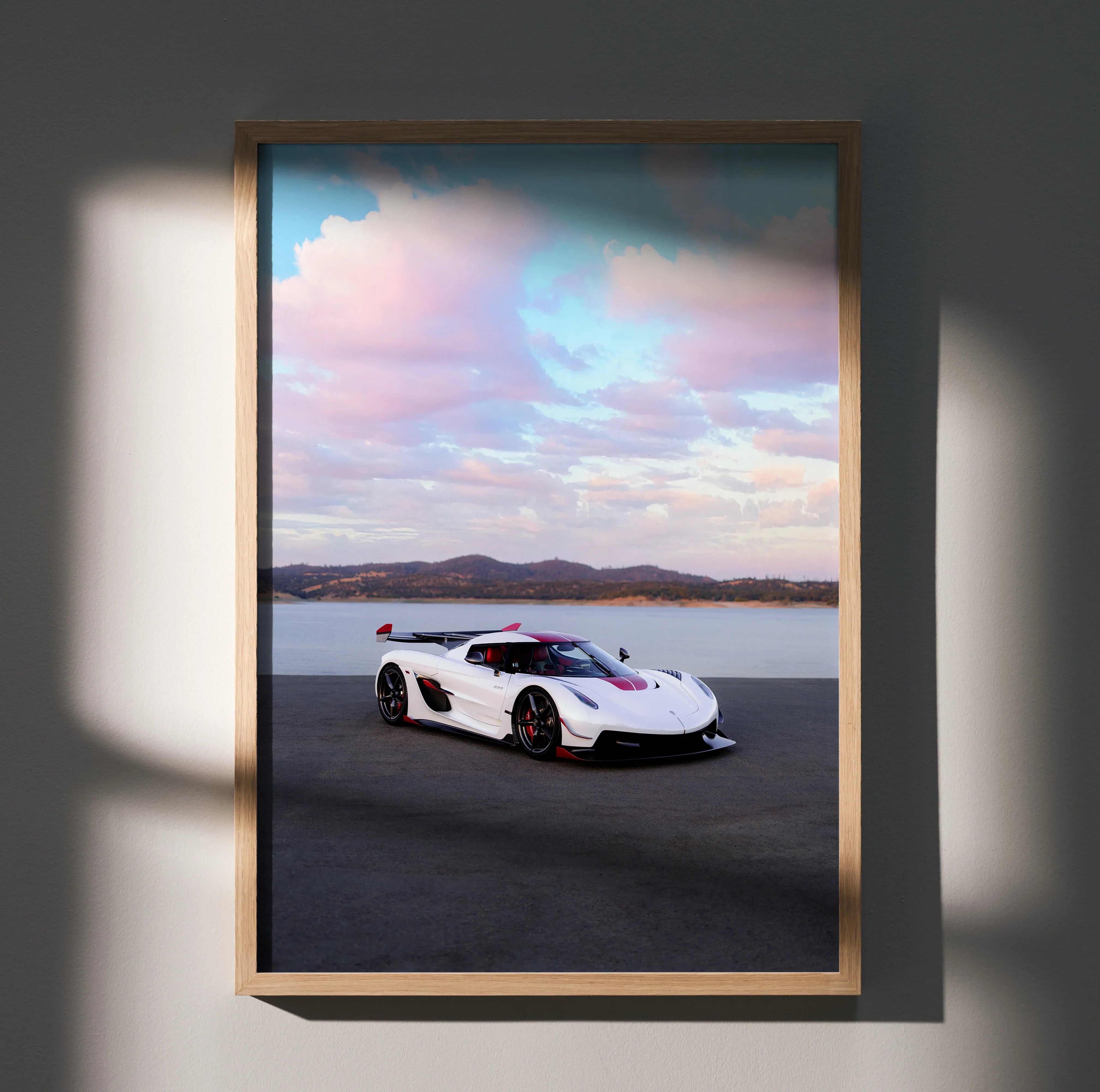 Koenigsegg Jesko sports car poster with sunset sky and desert landscape wall art.