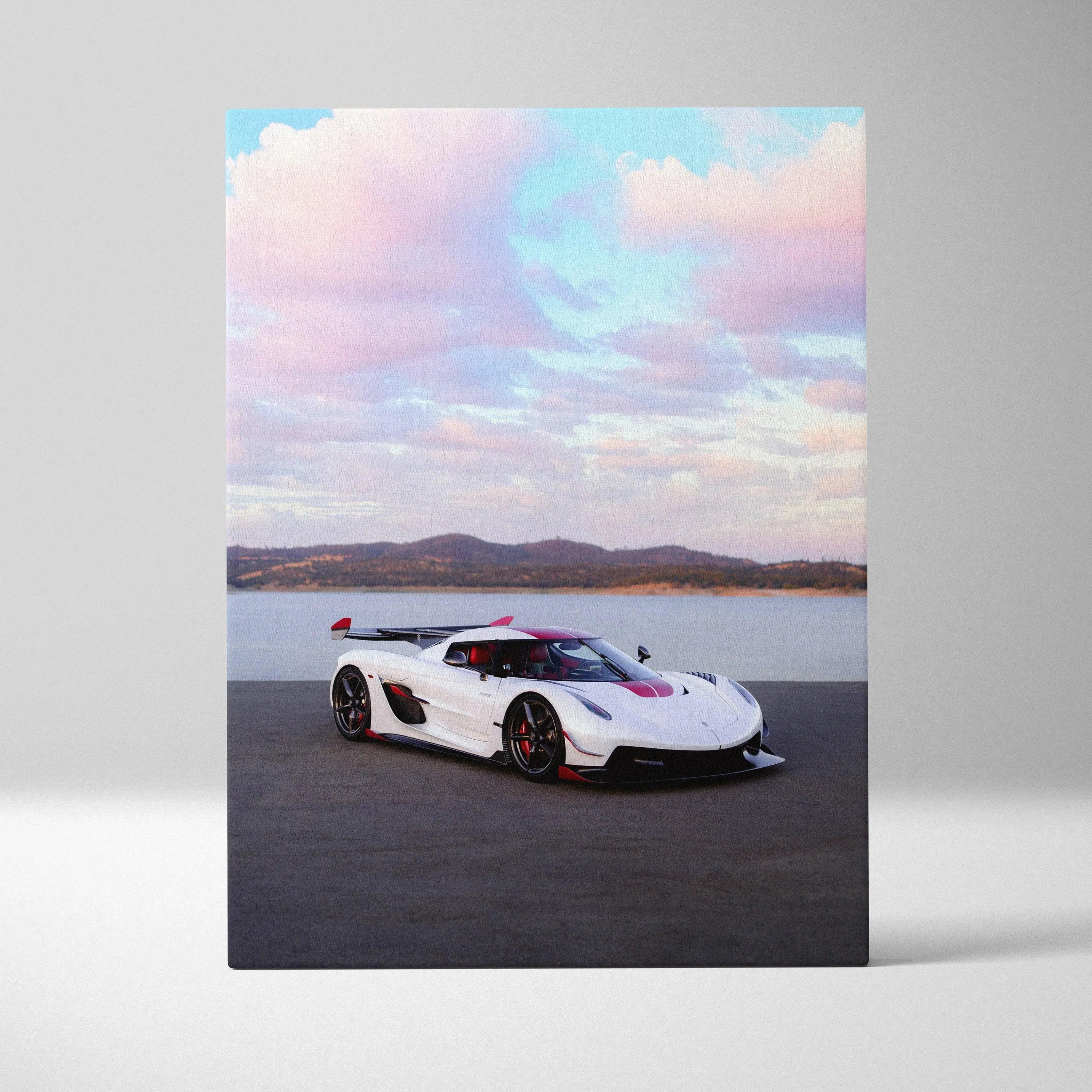 Koenigsegg Jesko supercar on asphalt with scenic sky canvas wall art.
