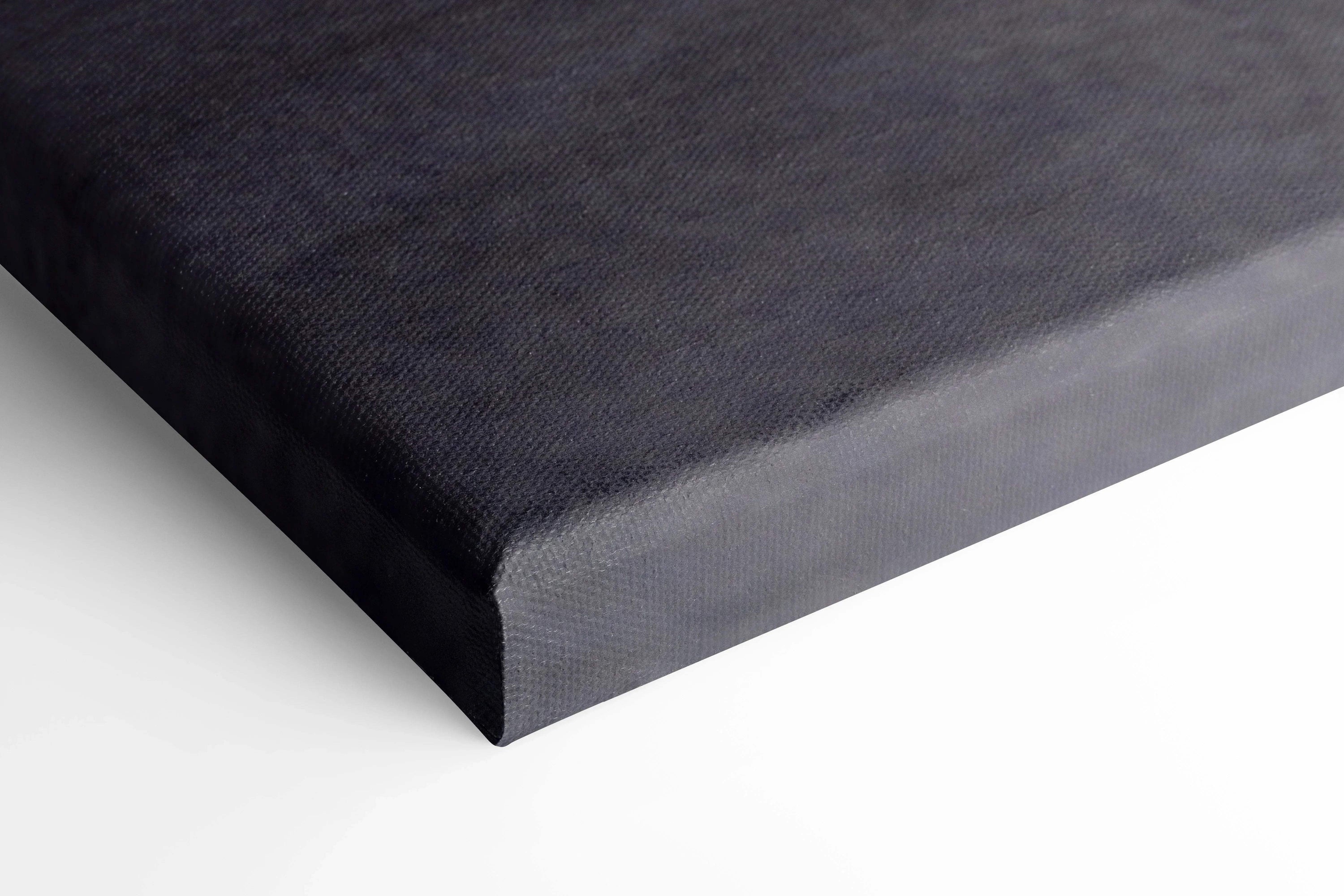 Close-up of black canvas wall art corner showing texture and wrapped edges for Koenigsegg Jesko car print.