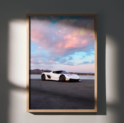 Koenigsegg Jesko poster featuring white sports car on open road under vibrant sunset sky wall art.