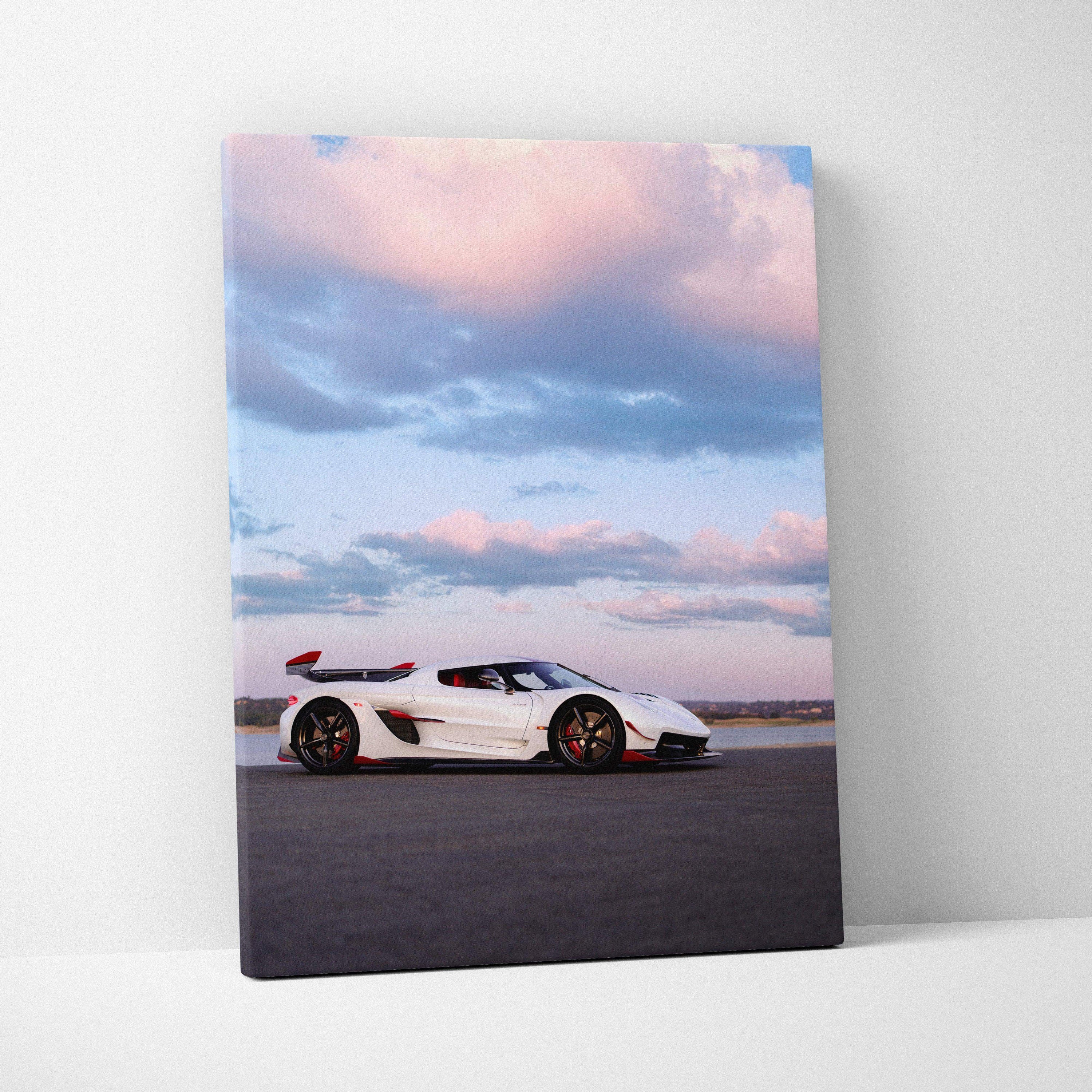 Vertical canvas wall art featuring a white Koenigsegg Jesko sports car under a pink and blue sky.