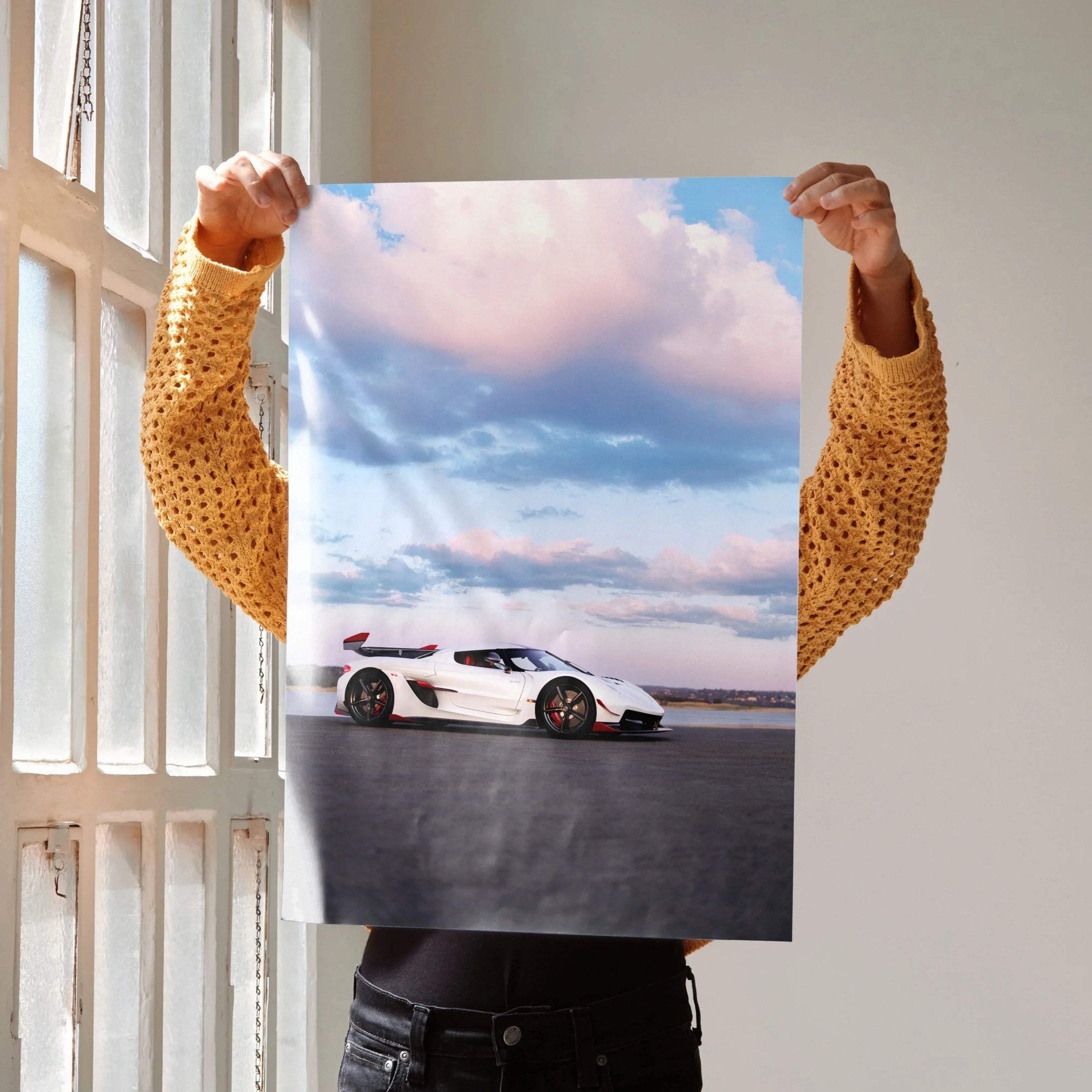 Koenigsegg Jesko car poster showing white sports car under blue sky with clouds, wall art.