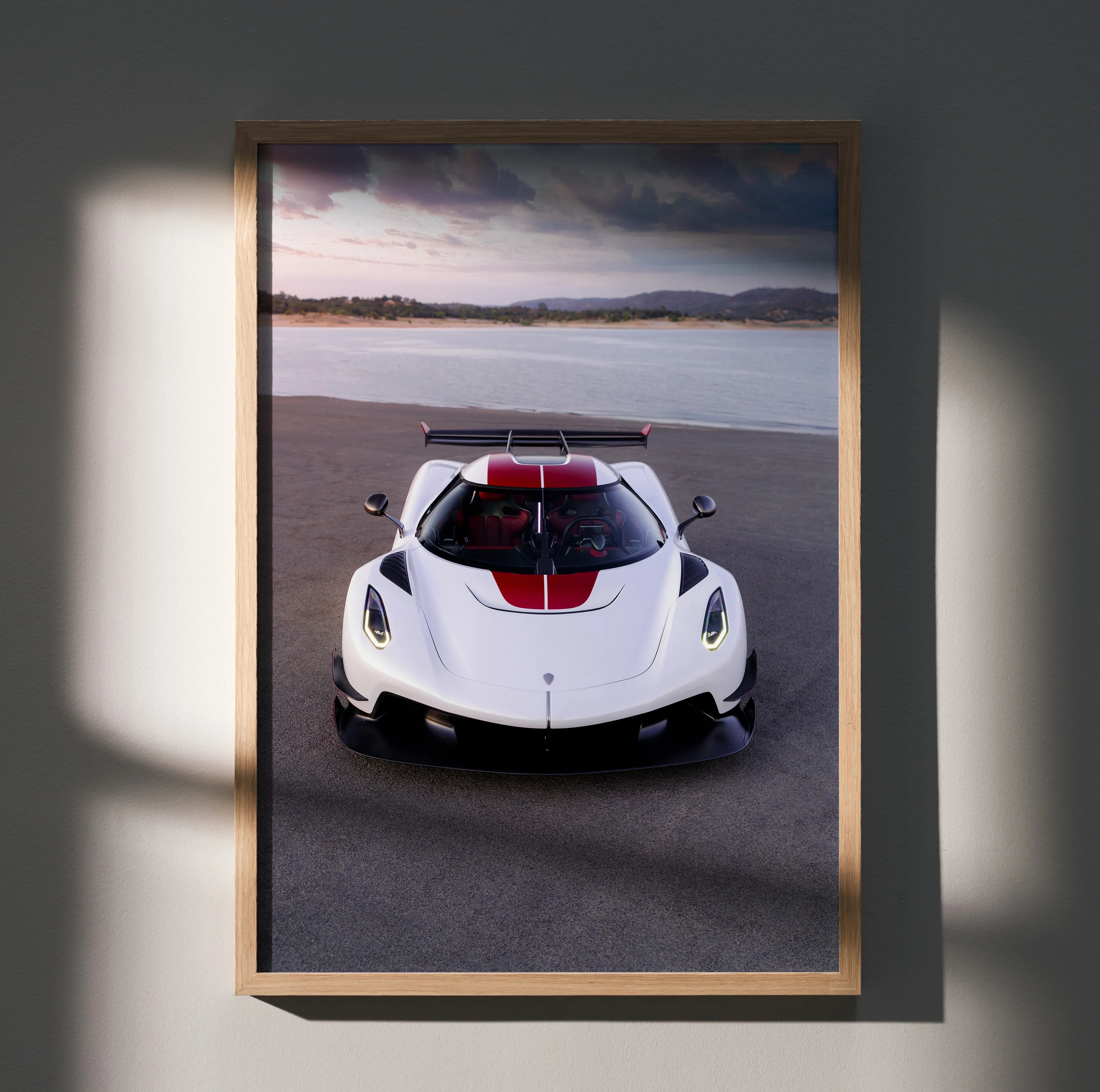 Koenigsegg Jesko sports car poster with white body and red stripe, sleek design wall art.