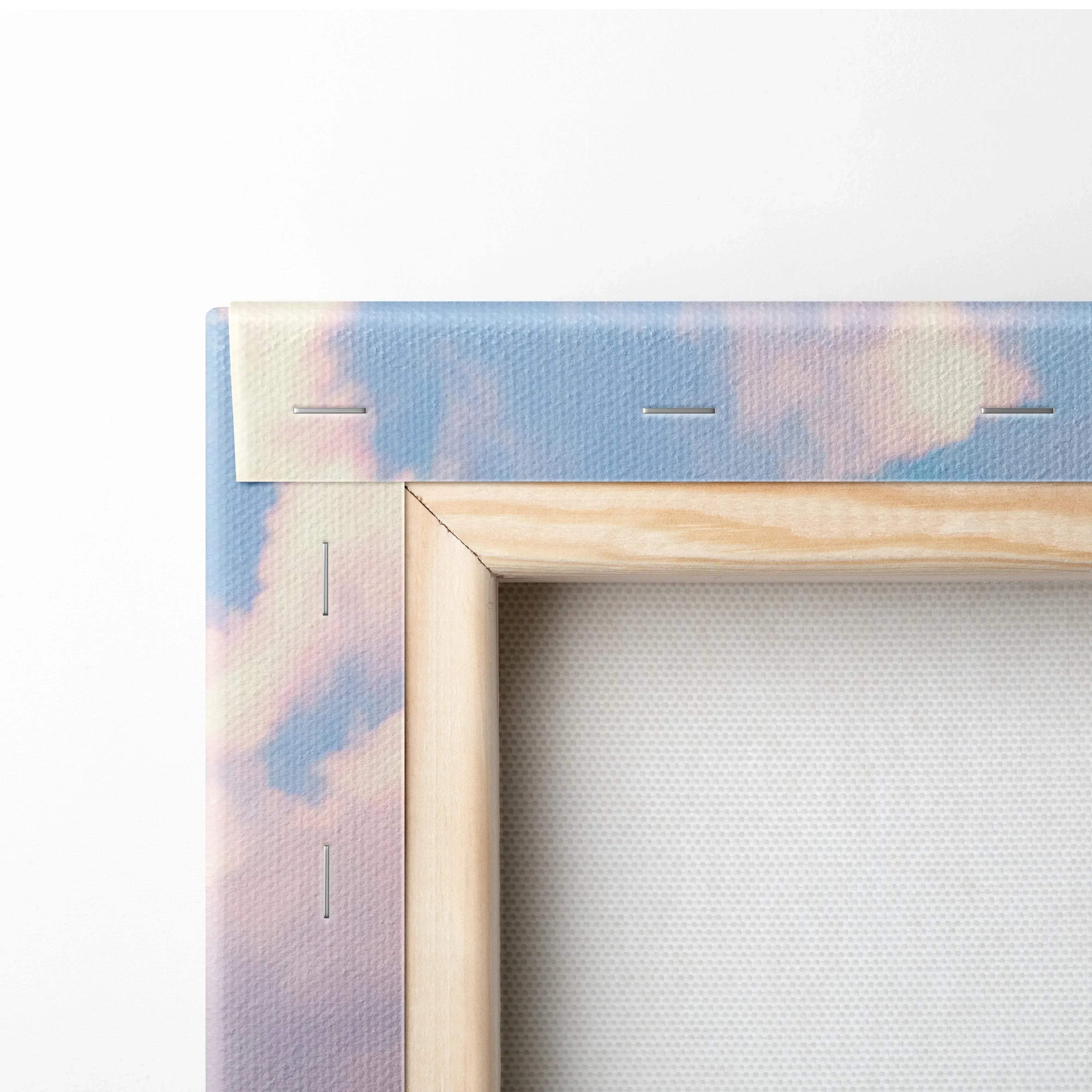Close-up of wooden frame corner and canvas texture with sky-themed wall art print.