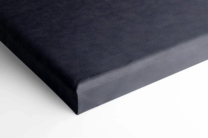 Close-up of black canvas wall art corner with smooth texture and clean wrapped edges.