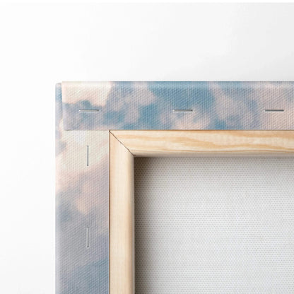 Close-up of wooden frame and canvas edge of vertical wall art with pastel cloud design Canvas Art.