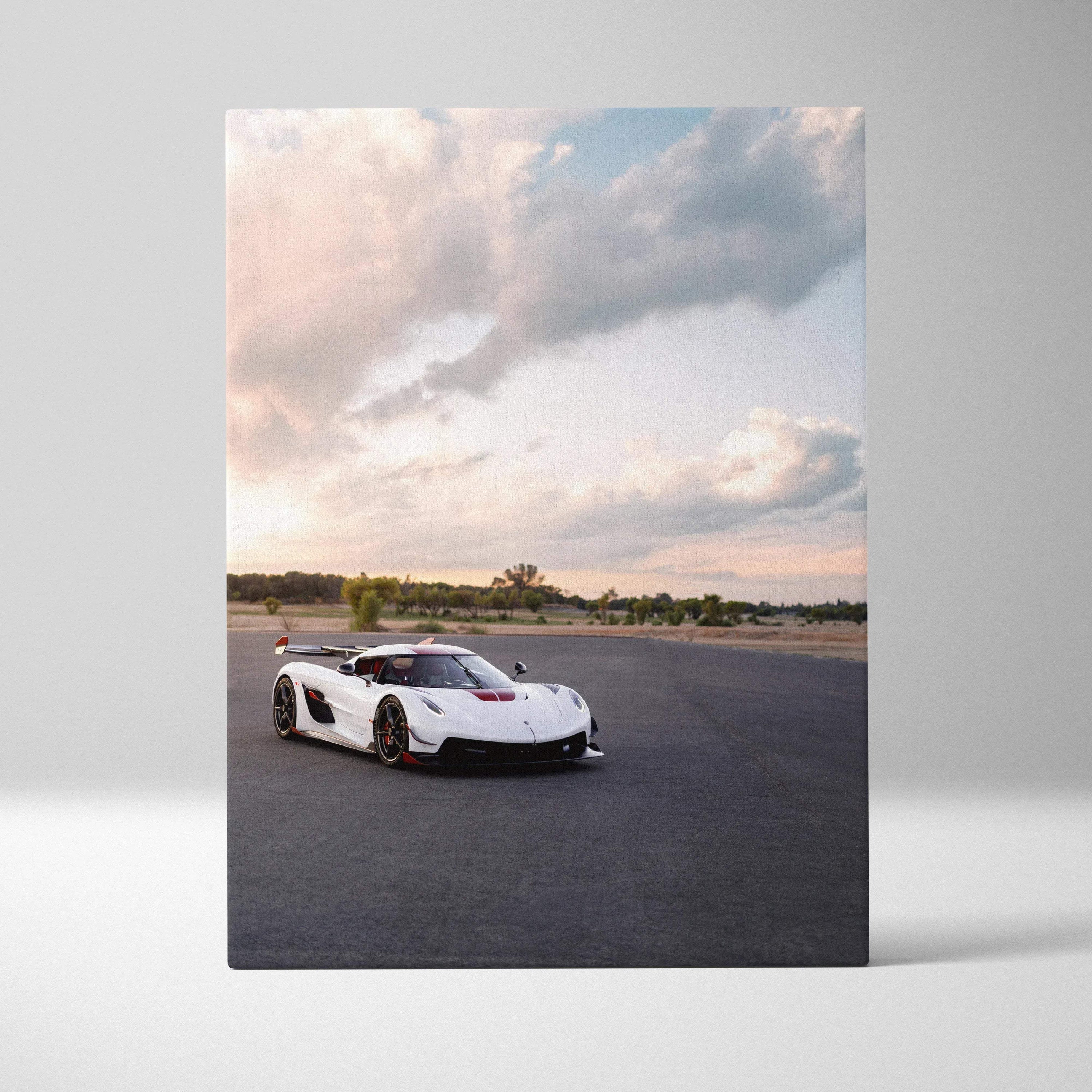Koenigsegg Jesko white sports car on asphalt under a cloudy sky vertical canvas wall art.