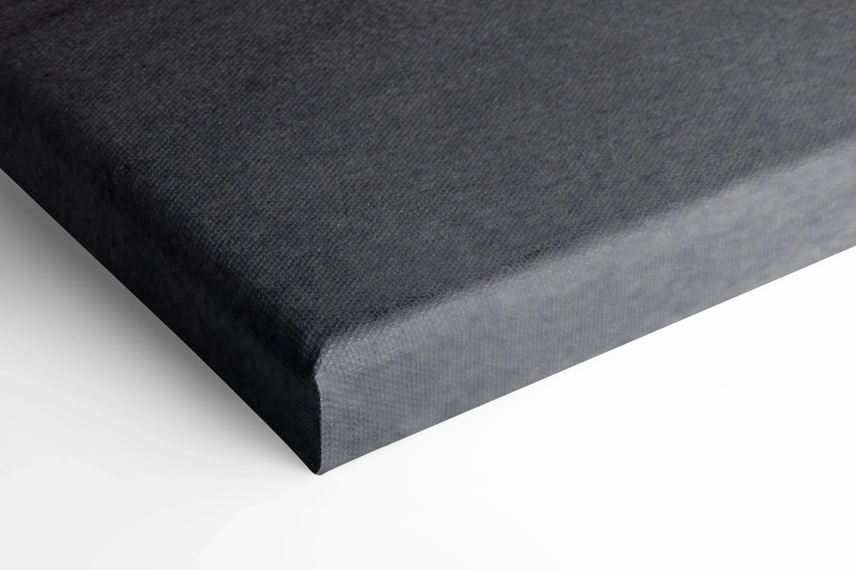 Black wrapped canvas corner showing texture and thickness for wall art display.