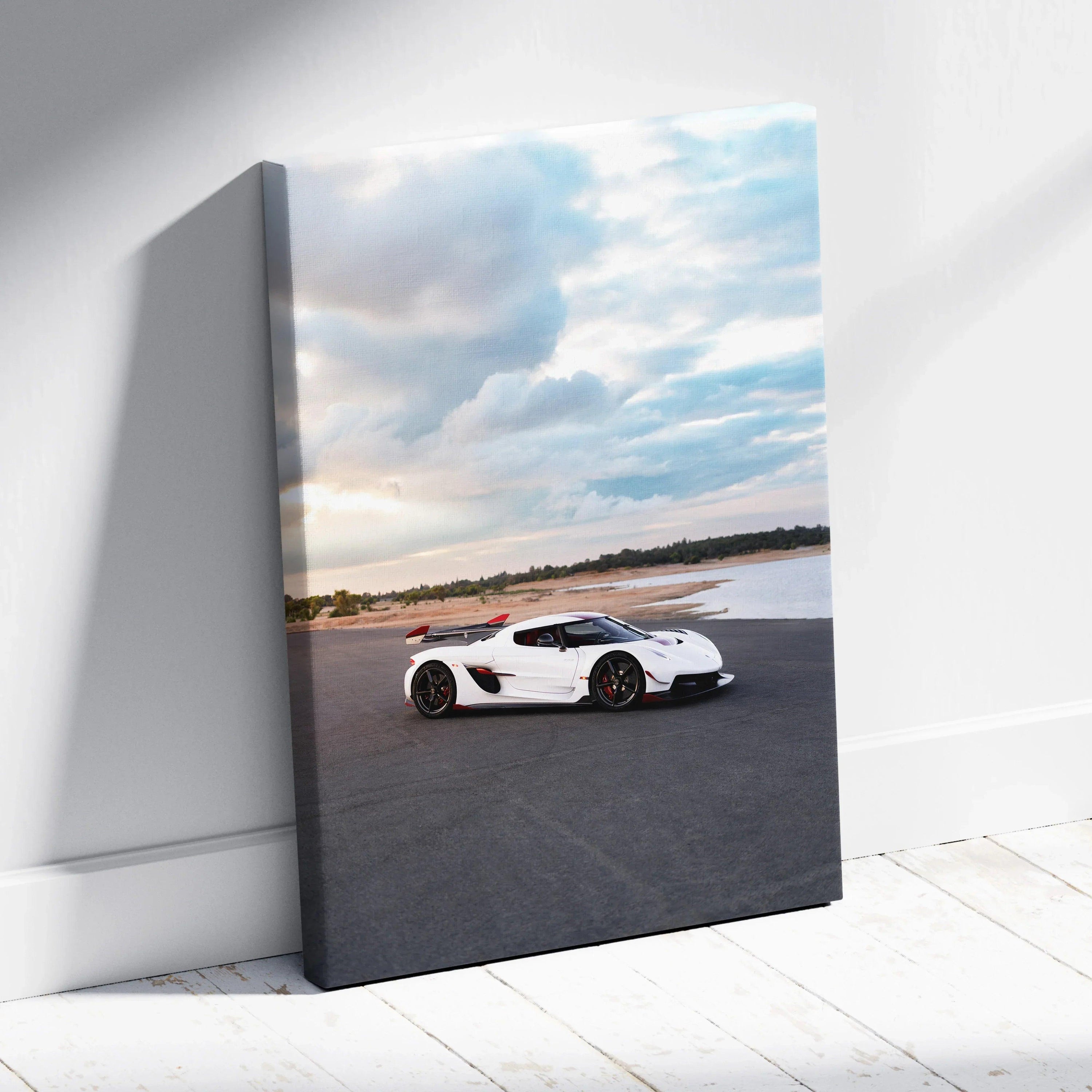Koenigsegg Jesko white sports car on road canvas wall art with cloudy sky background.