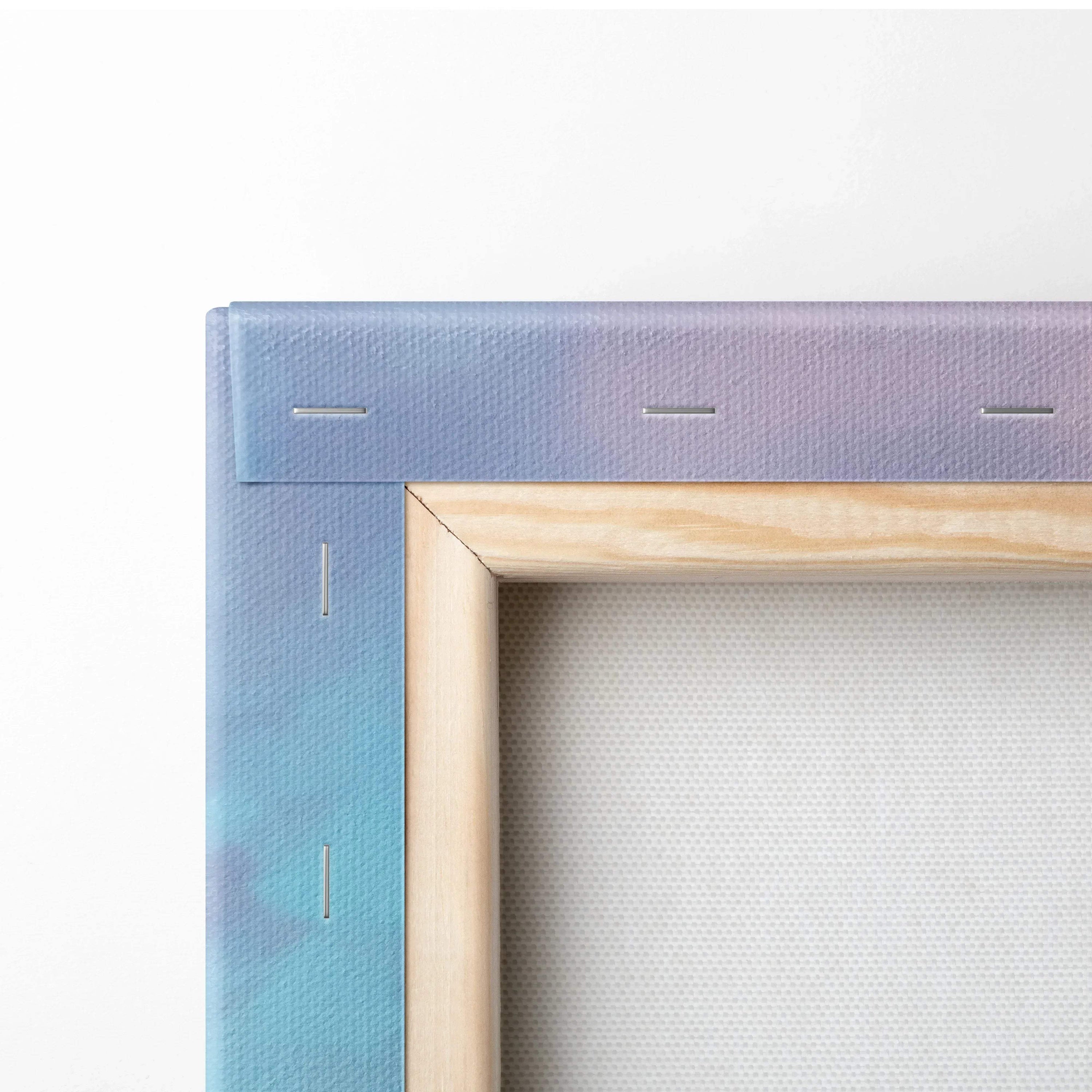 Close-up of wrapped canvas corner with wooden frame showing texture and staples for wall art canvas art print.