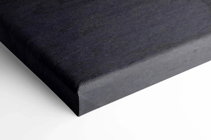 Black canvas wall art corner with smooth texture and gallery-wrapped edges in vertical format.