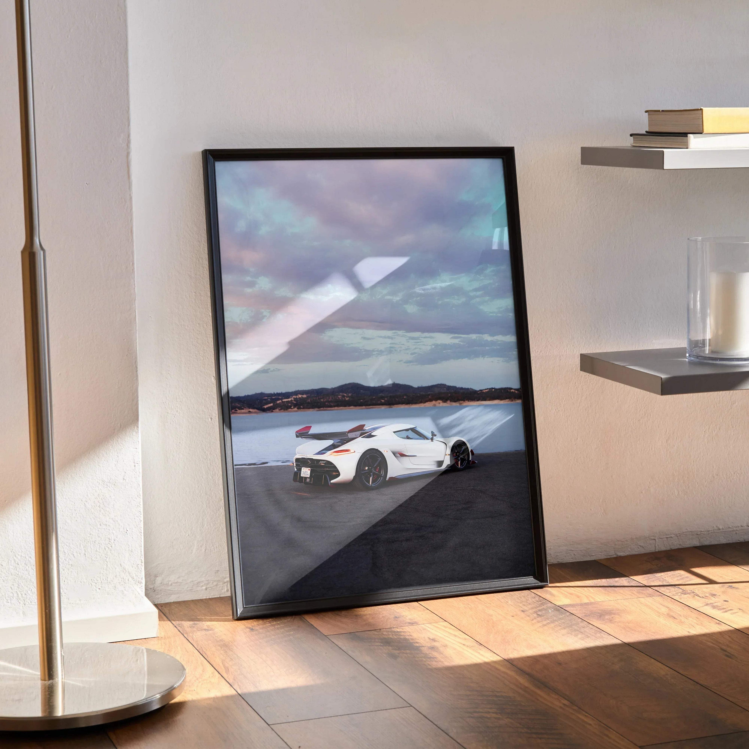 Koenigsegg Jesko white sports car poster with dramatic sunset sky wall art in black frame.