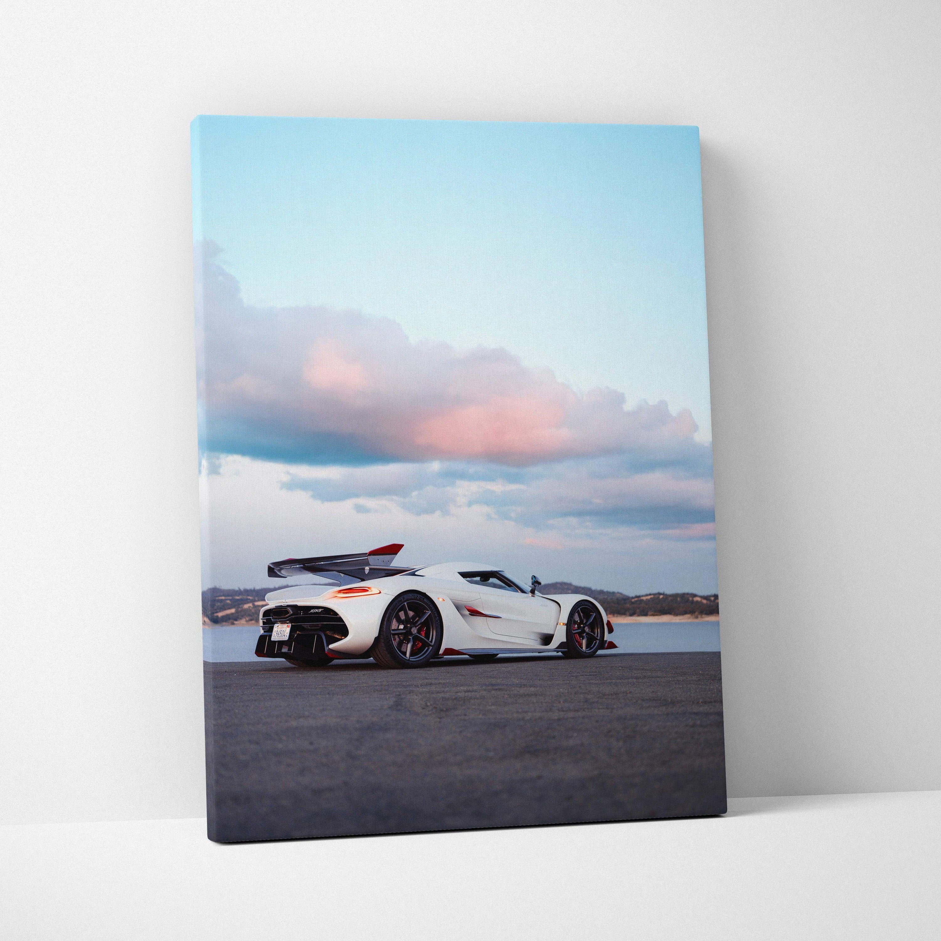 Vertical canvas wall art of a white Koenigsegg Jesko supercar under a pastel sky.
