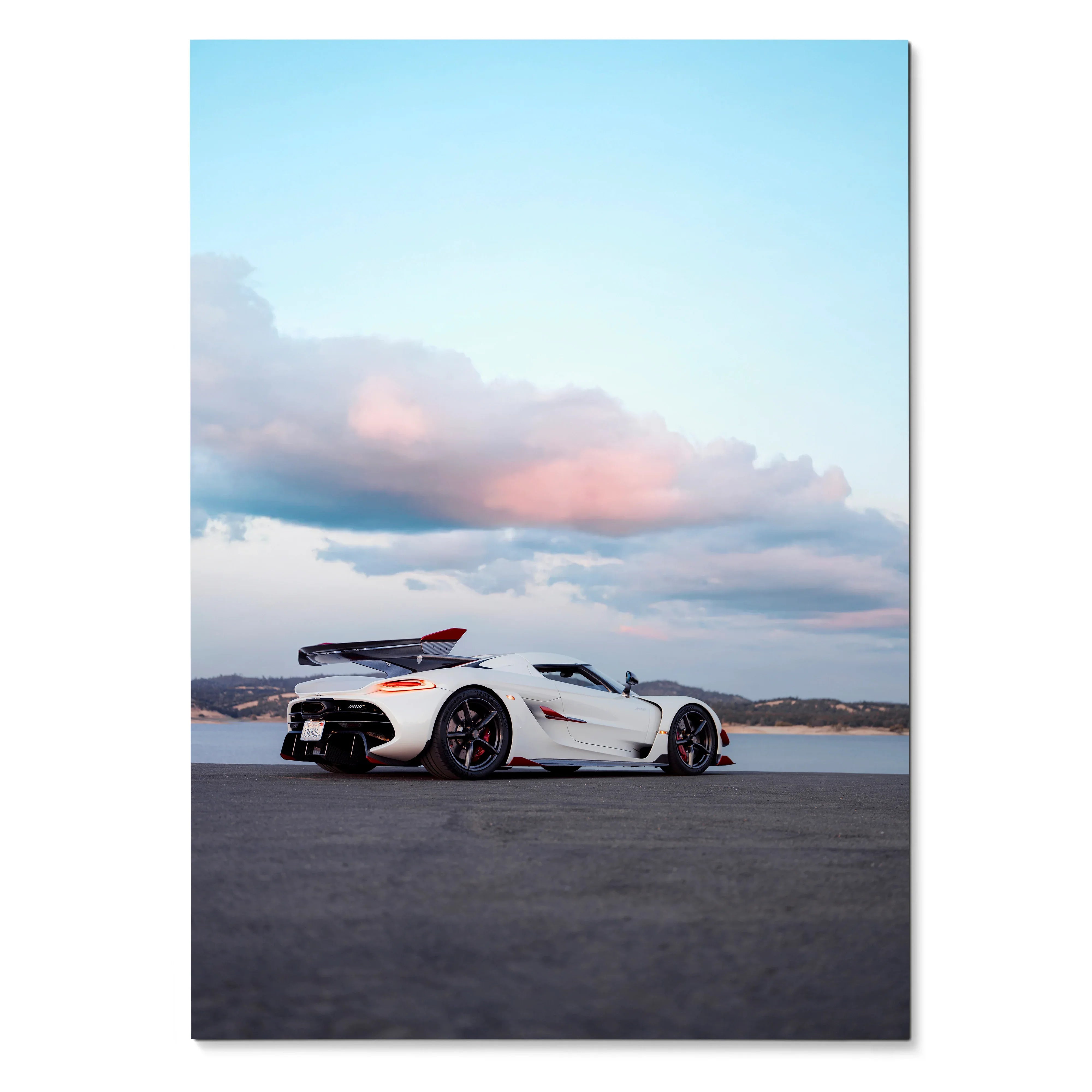 Koenigsegg Jesko white sports car poster with pink clouds and blue sky wall art.