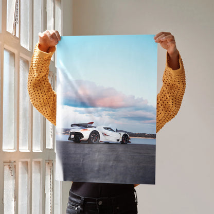 Koenigsegg Jesko poster featuring white sports car on open road under blue sky wall art.