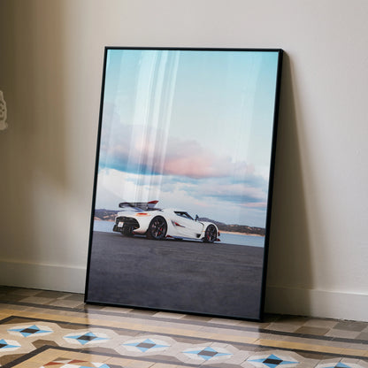 Koenigsegg Jesko poster featuring white sports car on open road under pastel sky wall art.