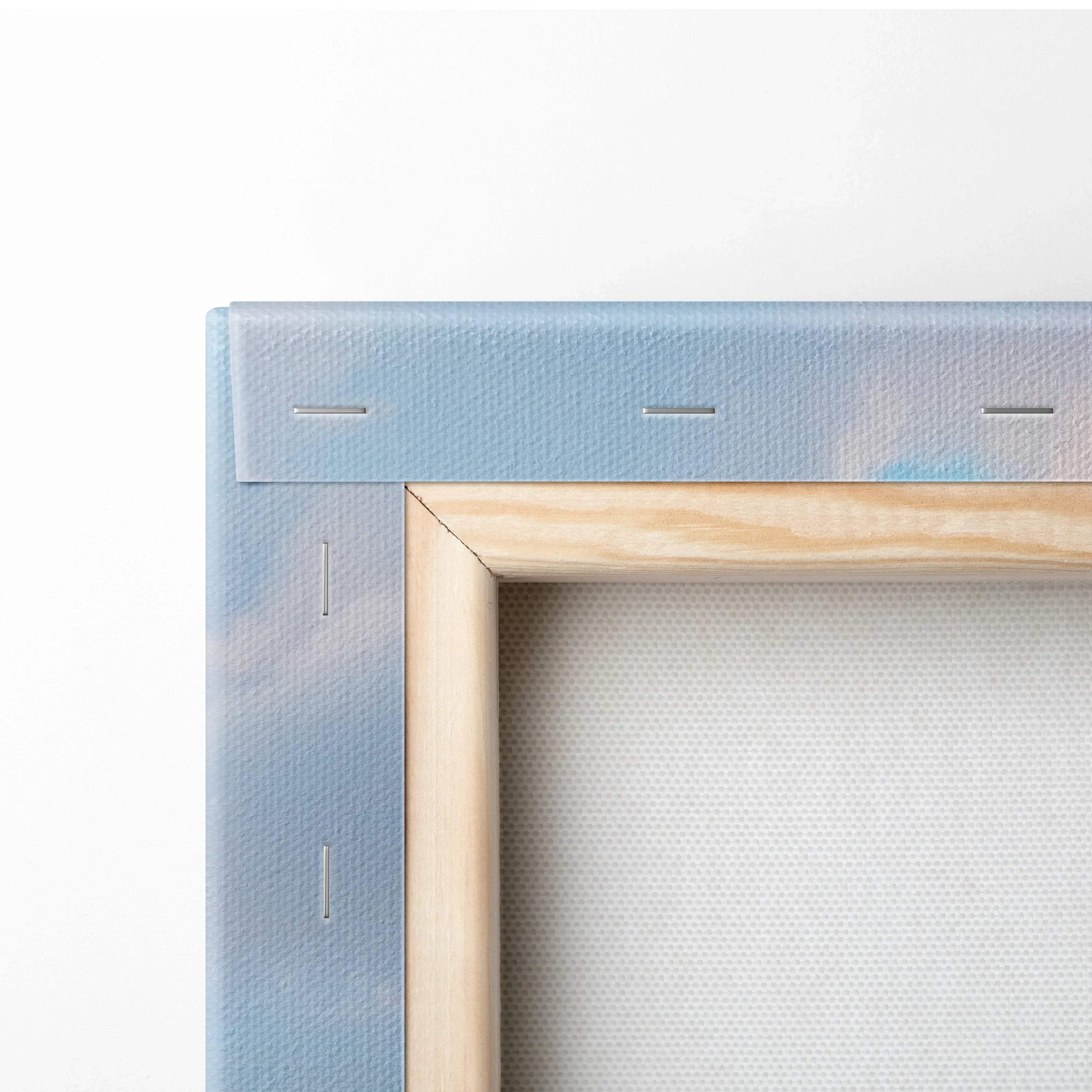 Close-up of stretched canvas on wooden frame showing corner staples for wall art canvas print.