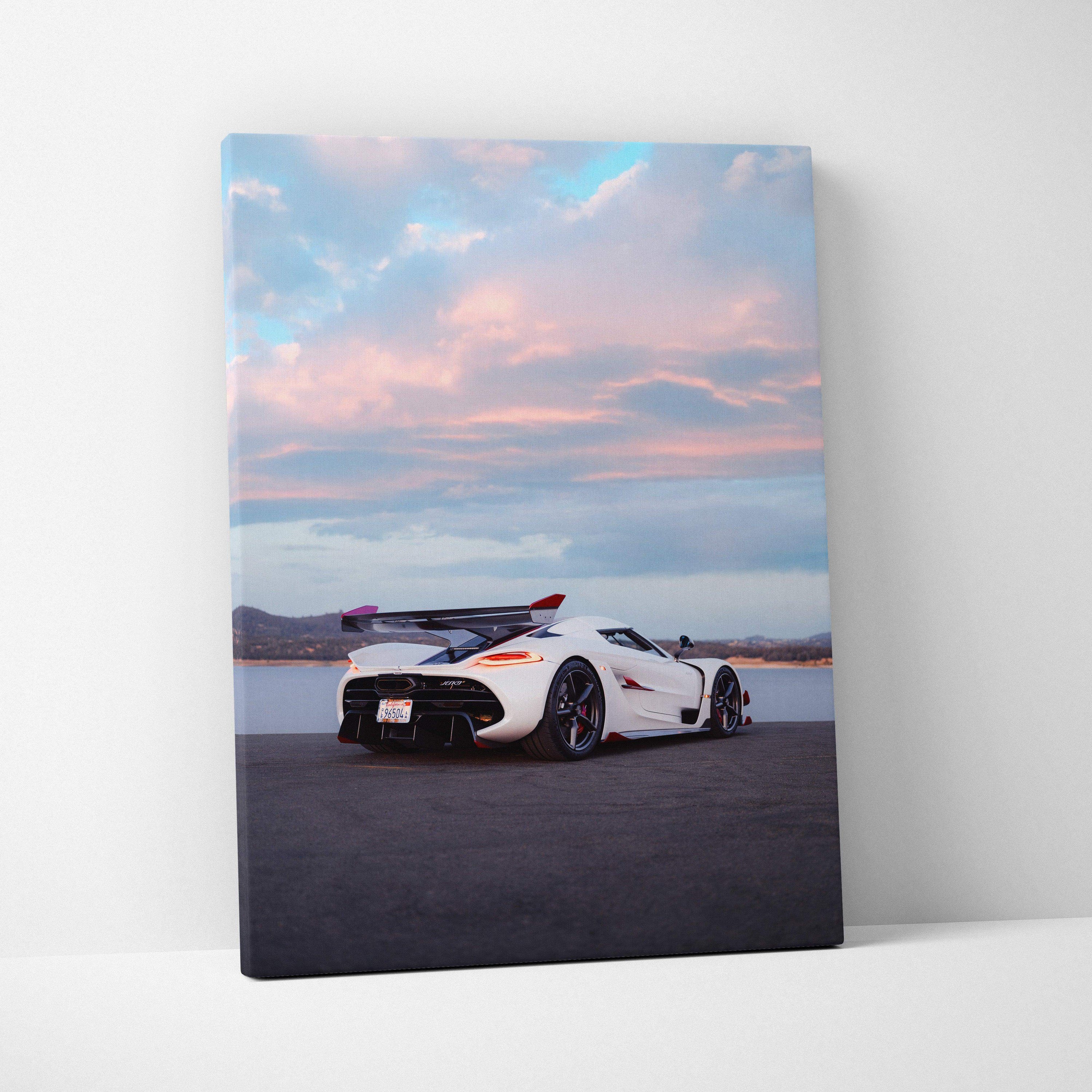 Vertical canvas wall art featuring a white Koenigsegg Jesko sports car under a pastel sunset sky.