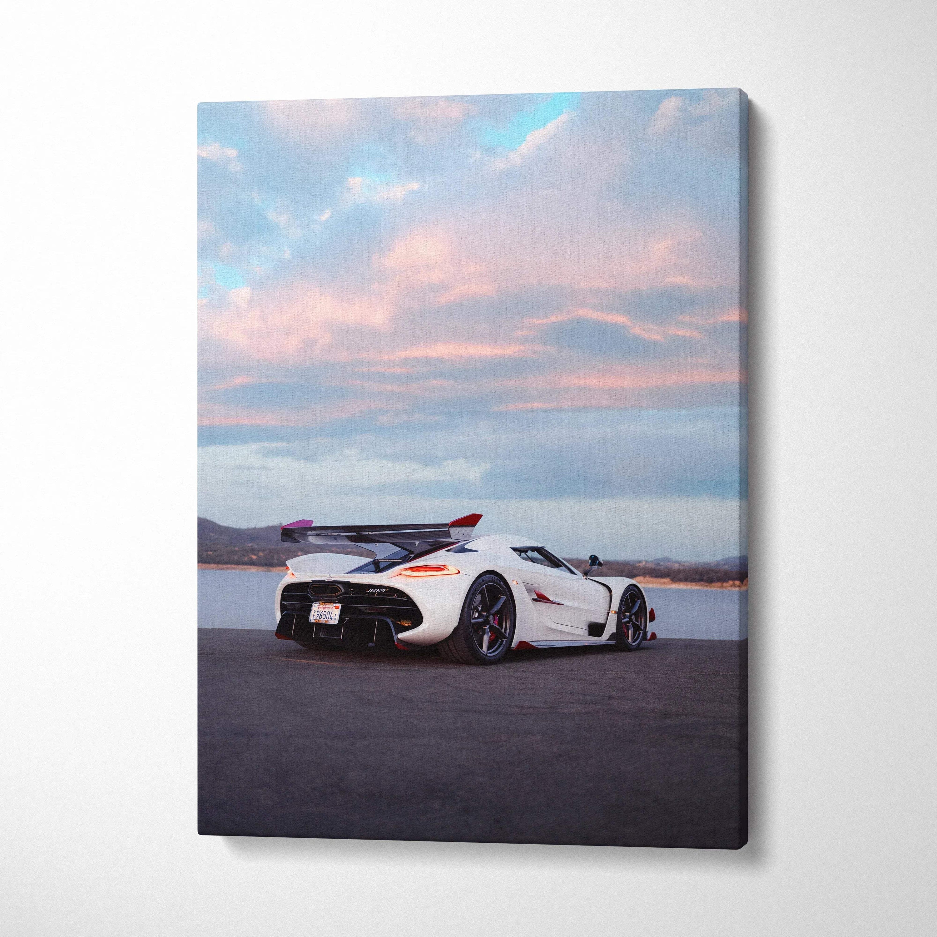 Koenigsegg Jesko white sports car against a colorful sunset sky canvas wall art.