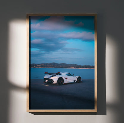 Koenigsegg Jesko white supercar on racetrack with blue sky poster wall art in wooden frame.