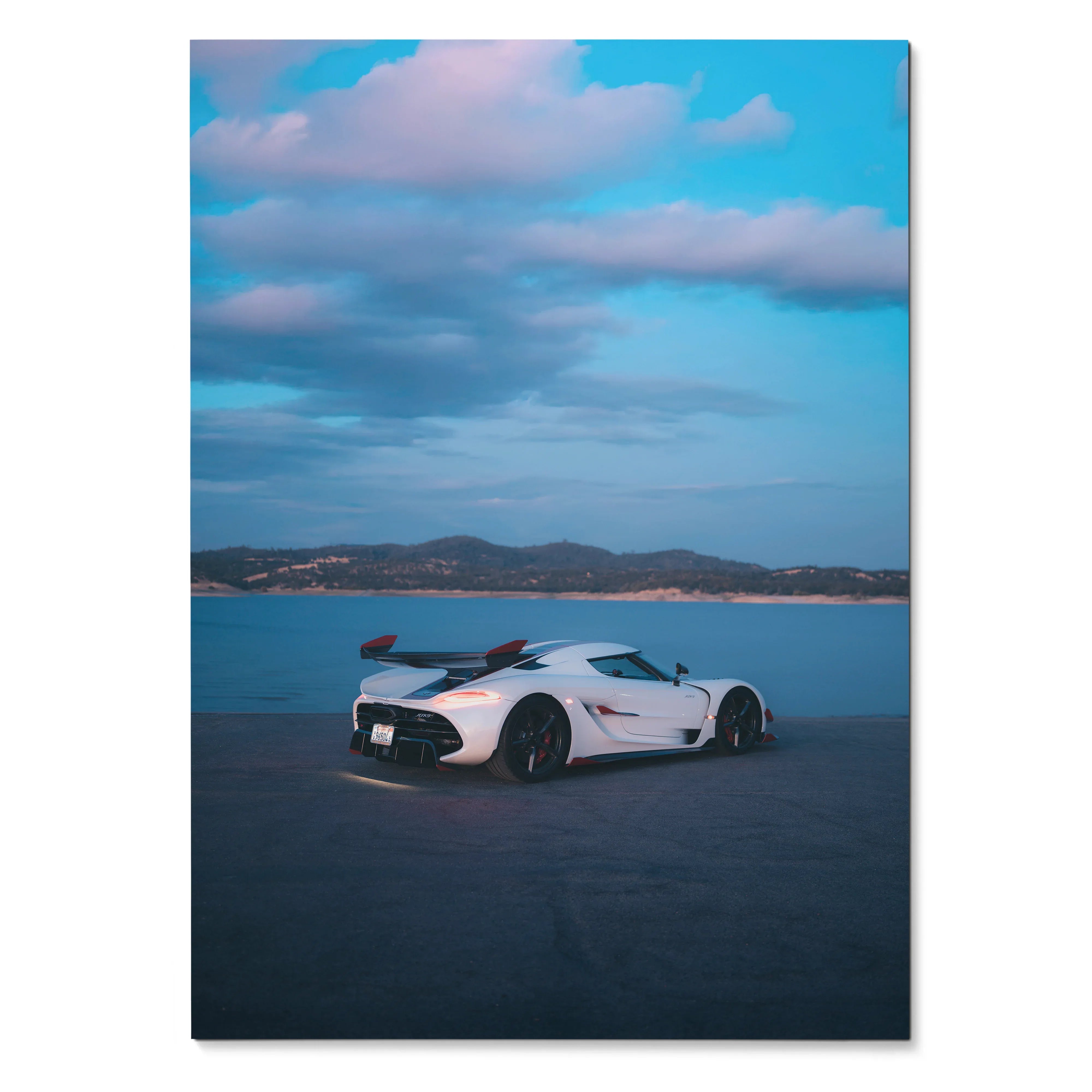 Koenigsegg Jesko white sports car poster with ocean and cloudy sky background wall art.