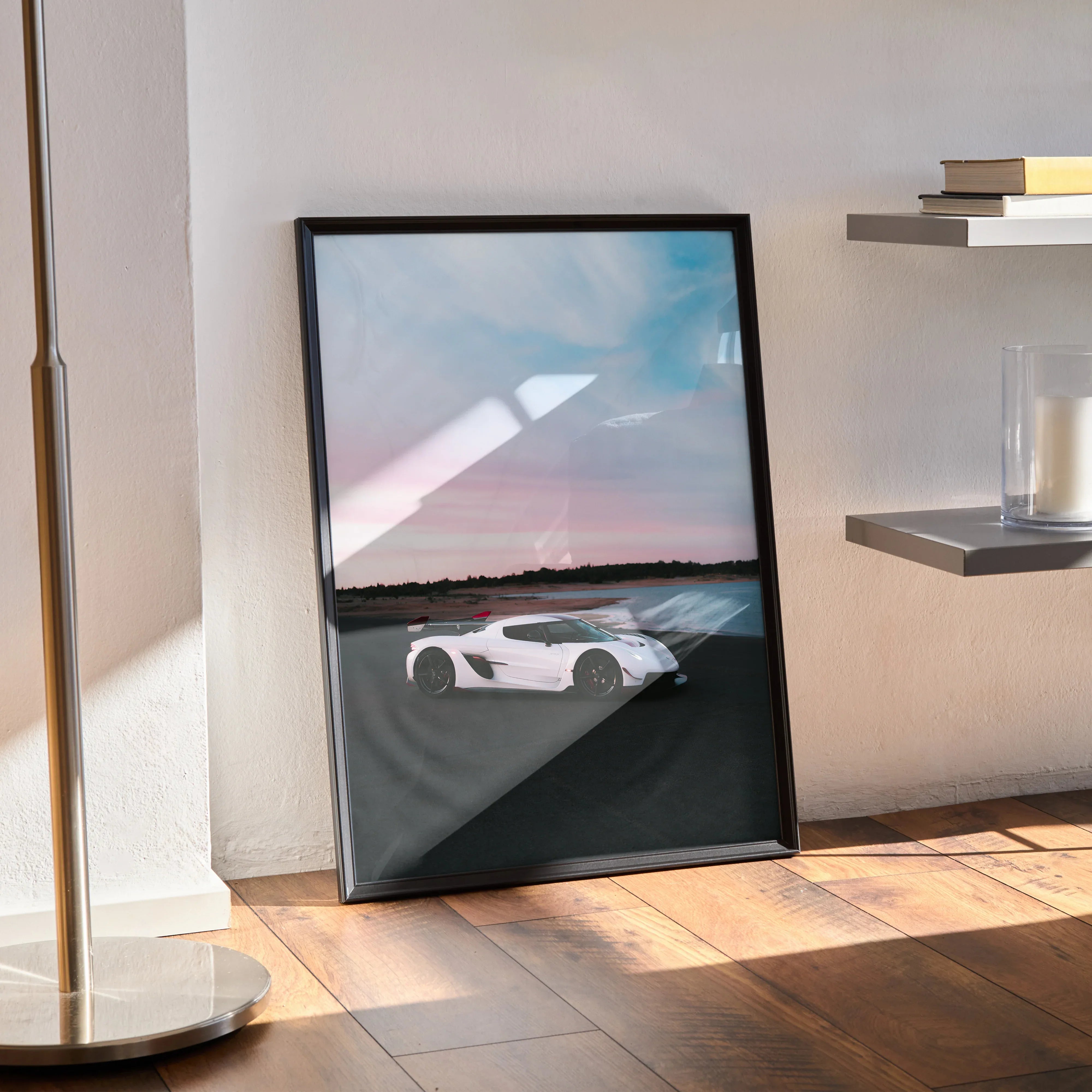 Koenigsegg Jesko white sports car poster with sunset sky wall art in black frame.