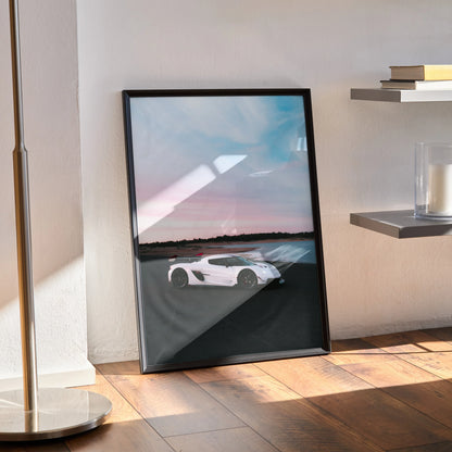 Koenigsegg Jesko white sports car poster with sunset sky wall art in black frame.