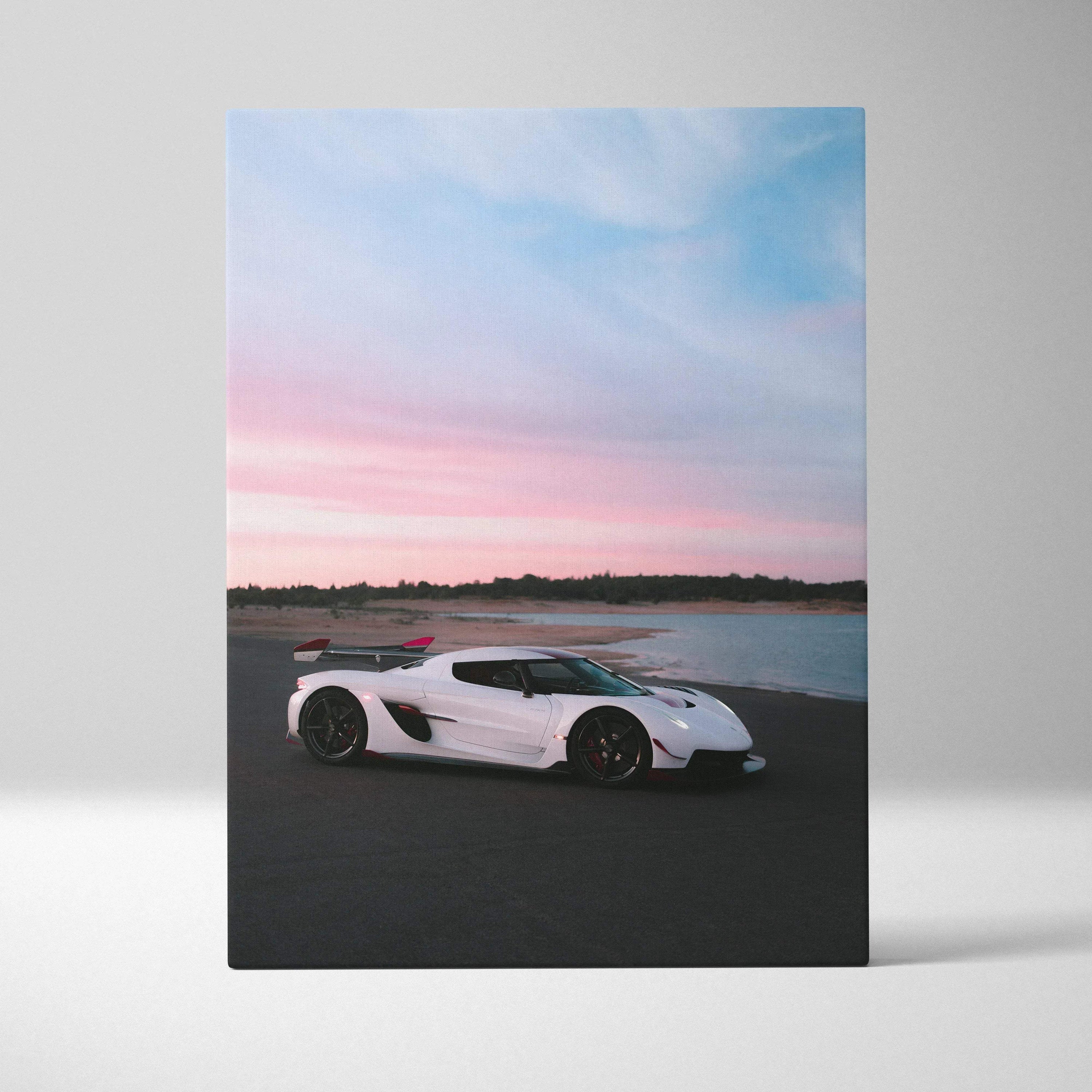 Vertical canvas wall art featuring a white Koenigsegg Jesko sports car against a sunset sky.