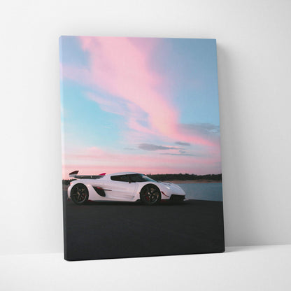 Koenigsegg Jesko white sports car at sunset on canvas wall art with pink and blue sky background.