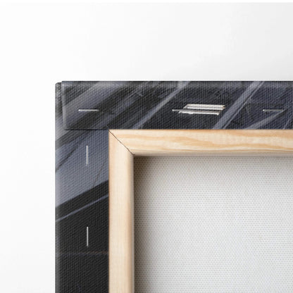 Close-up of wooden frame and textured canvas surface on vertical wall art canvas print.