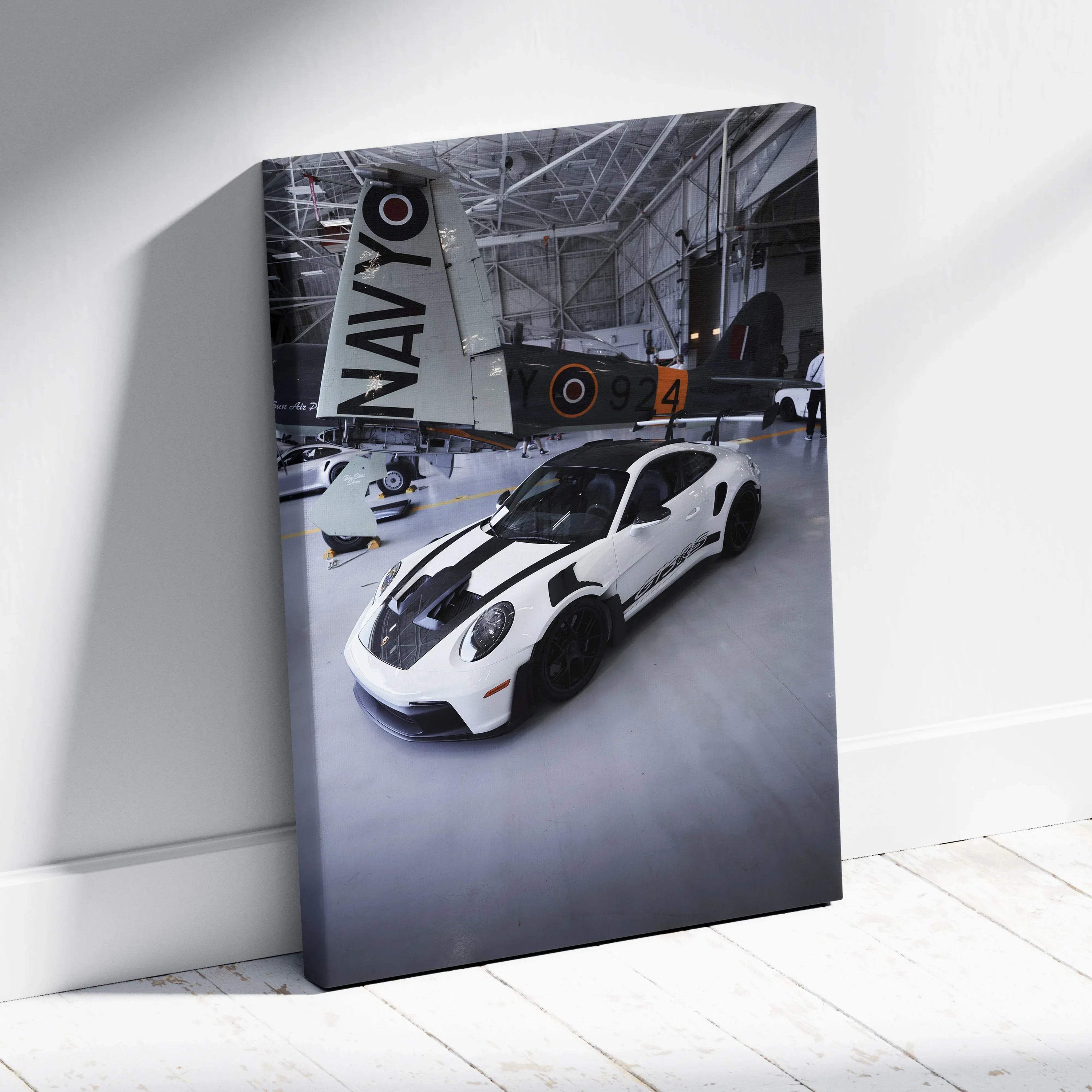 Porsche 911 GT3RS white sports car in hangar canvas wall art vertical canvas art print.