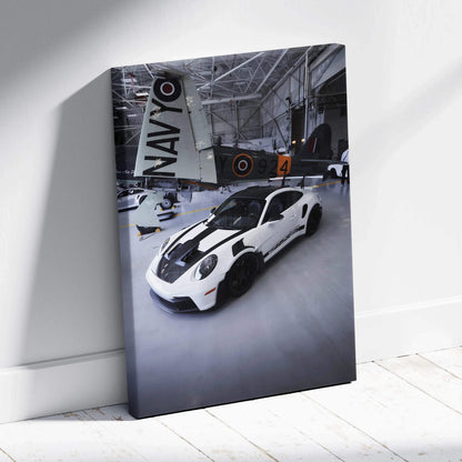 Porsche 911 GT3RS white sports car in hangar canvas wall art vertical canvas art print.