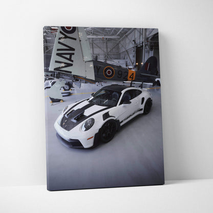 White Porsche 911 GT3RS with black racing stripes canvas wall art in sleek indoor setting.