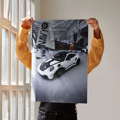 Porsche 911 GT3 RS white sports car poster with vintage airplane hangar wall art.