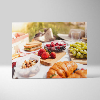 Canvas wall art featuring fresh strawberries, green grapes, nuts, and croissant on a bright lunch table setting.