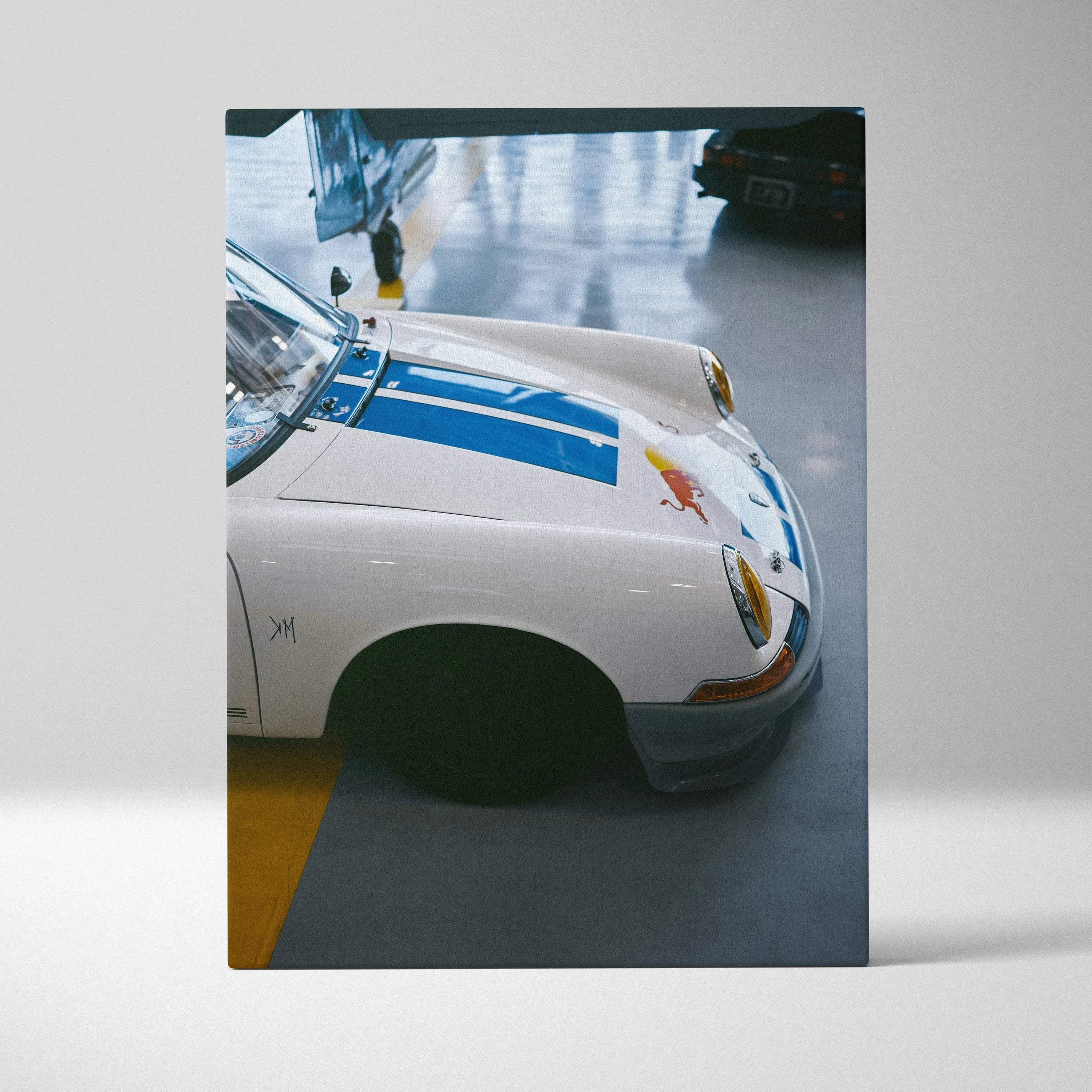 White Porsche 911 front hood with blue racing stripes canvas wall art, vertical canvas art print.