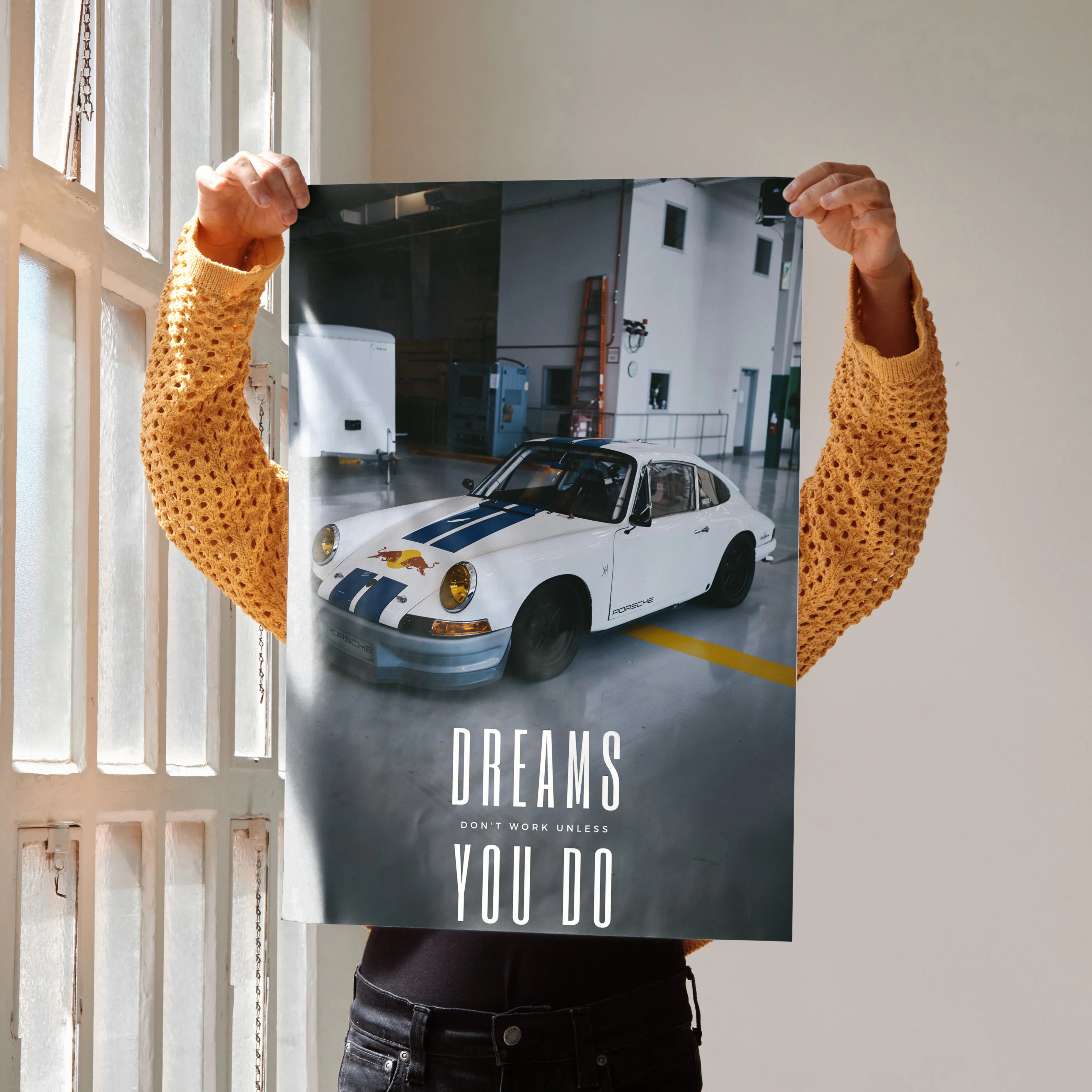 Motivational poster with white Porsche 911 Classic and inspiring text "Dreams You Do" wall art.