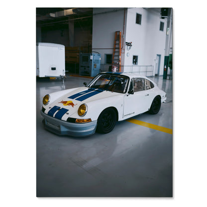 White Porsche 911 classic car with blue racing stripes on wall art poster.