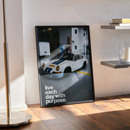 Motivational poster wall art featuring a white Porsche 911 classic with text "live each day with purpose".