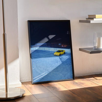 Toyota MR2 poster wall art featuring a yellow sports car on a blue racetrack backdrop.