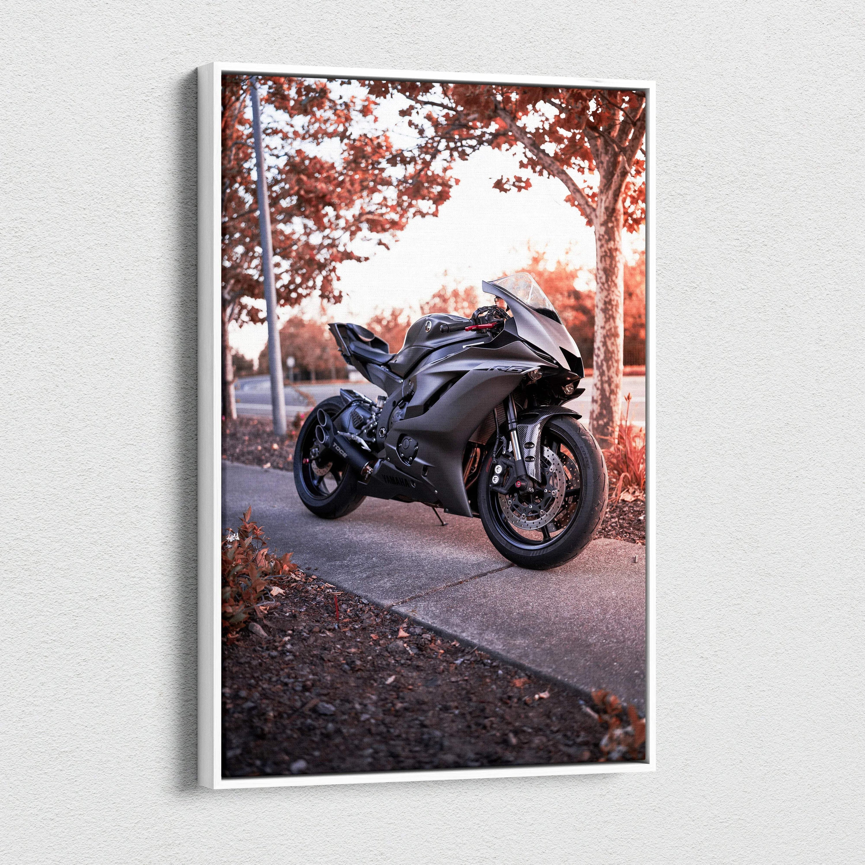 Yamaha R6 motorcycle in black parked on sidewalk autumn scene canvas wall art.