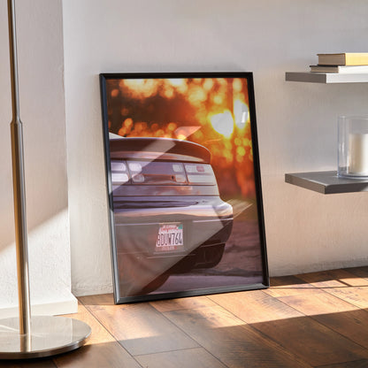 Nissan 300ZX poster wall art featuring rear view with sunset bokeh in black frame.