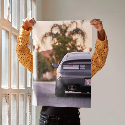 Nissan 300ZX rear view art print held up near window, automotive poster wall art.