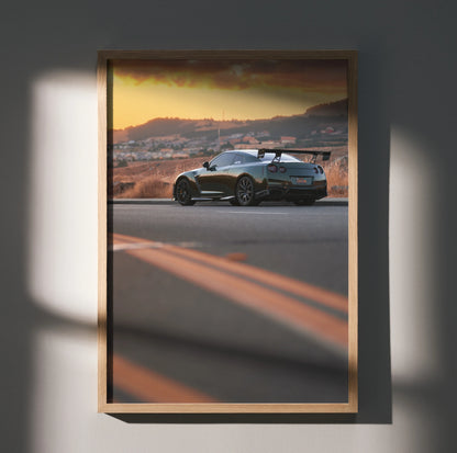 Nissan GTR R35 parked on road at sunset with mountains in background premium poster wall art.