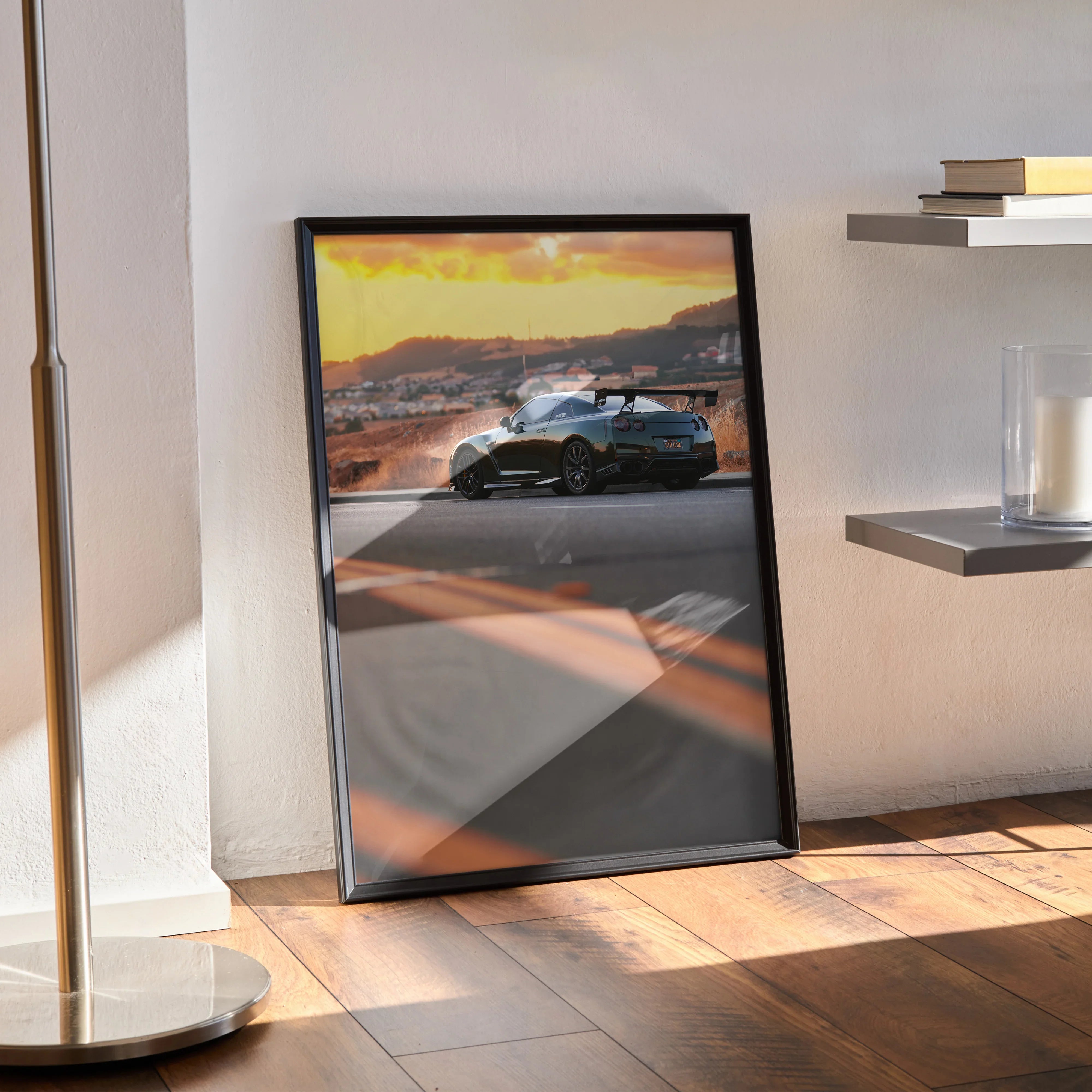 Nissan GTR R35 poster with sunset background leaning against wall as premium high-resolution wall art.